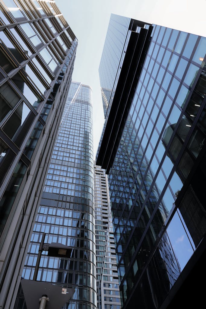 View from below of modern skyscrapers in Frankfurt am Main, Hessen, showcasing contemporary architecture.